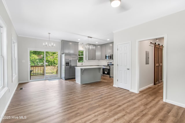 401 Singletary St SE, Wilson, NC 27893 - unfurnished living room with a chandelier, crown molding, electric panel, light wood-style flooring, and baseboards