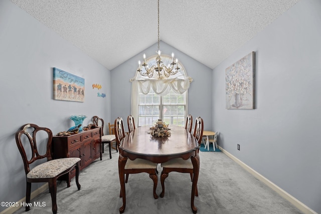 dining room with an inviting chandelier, lofted ceiling, light carpet, baseboards, and a textured ceiling