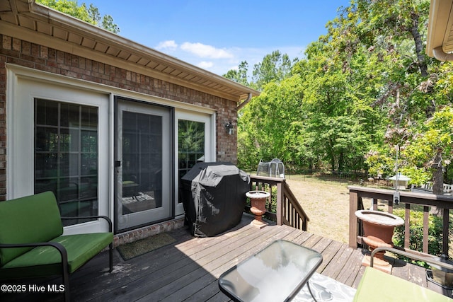wooden deck featuring area for grilling
