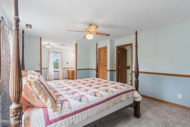 bedroom with visible vents, a closet, baseboards, ceiling fan, and carpet flooring