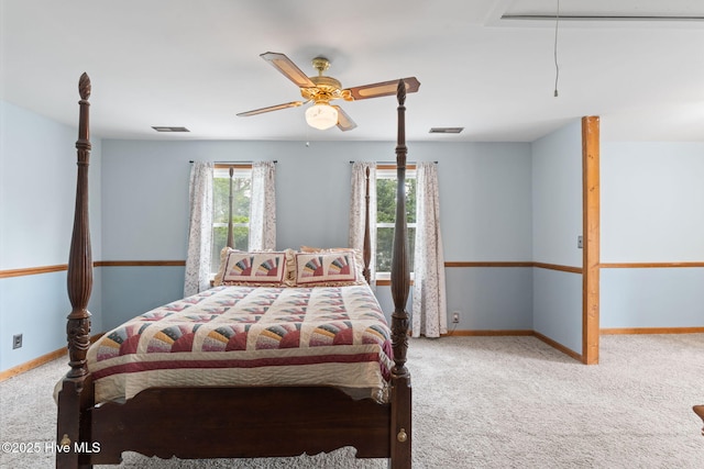 bedroom with visible vents, attic access, and carpet