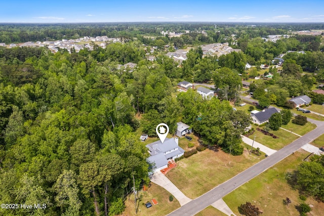 bird's eye view featuring a residential view and a forest view