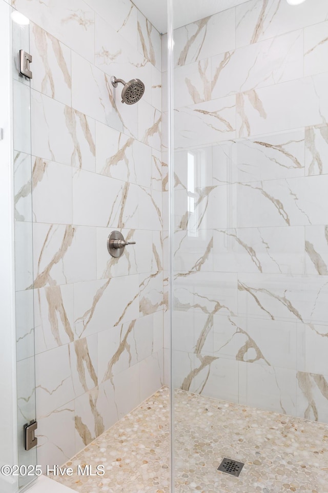 bathroom featuring a shower stall