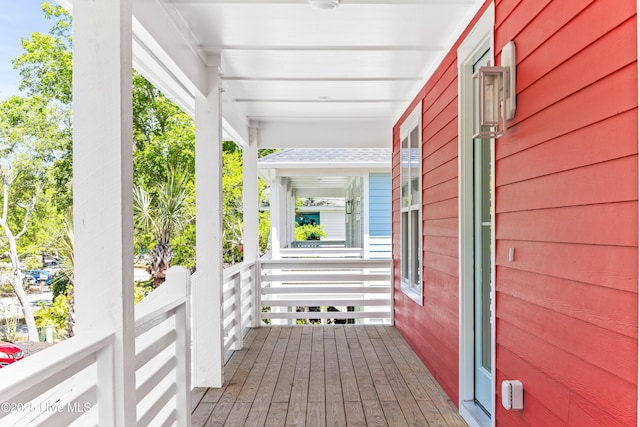 wooden terrace with a porch