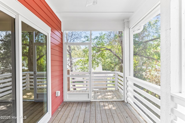 unfurnished sunroom featuring plenty of natural light