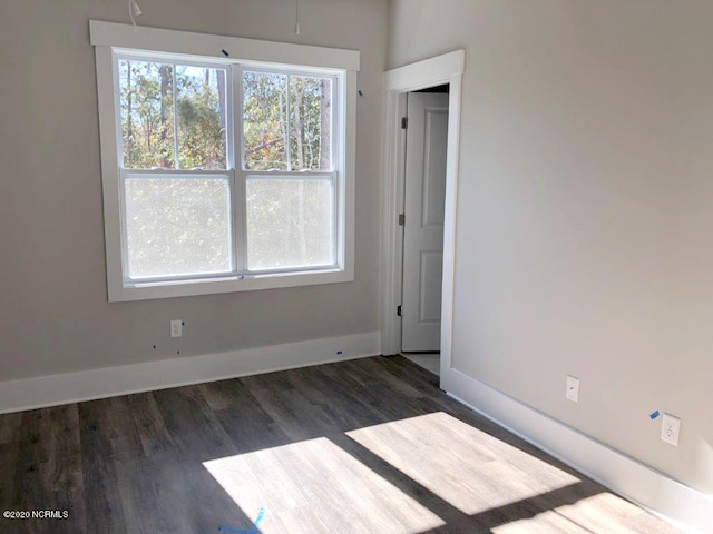 4006 Tamarisk Ln, Wilmington, NC 28409 - spare room featuring baseboards and wood finished floors