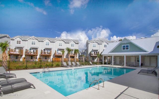 4006 Tamarisk Ln, Wilmington, NC 28409 - community pool featuring a residential view, fence, and a patio