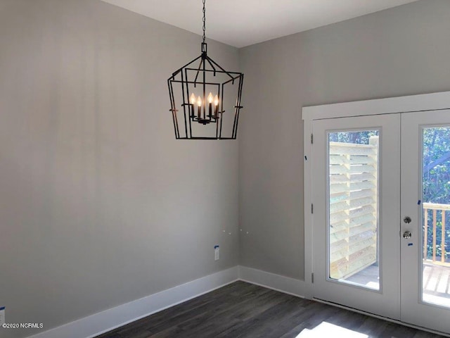 4006 Tamarisk Ln, Wilmington, NC 28409 - doorway to outside featuring baseboards, french doors, dark wood-style flooring, and a notable chandelier