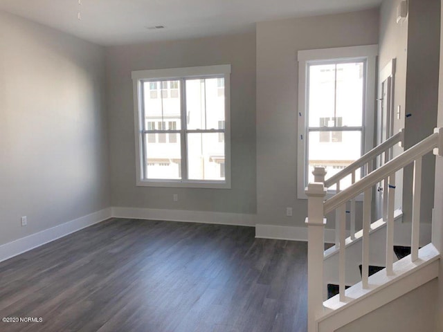 4006 Tamarisk Ln, Wilmington, NC 28409 - entrance foyer featuring baseboards, dark wood-style flooring, stairs, and visible vents