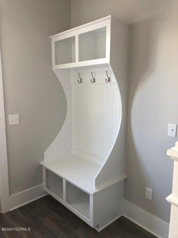 4006 Tamarisk Ln, Wilmington, NC 28409 - mudroom with dark wood-type flooring and baseboards