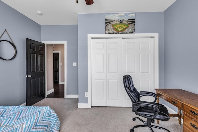 bedroom featuring carpet floors, baseboards, and a closet
