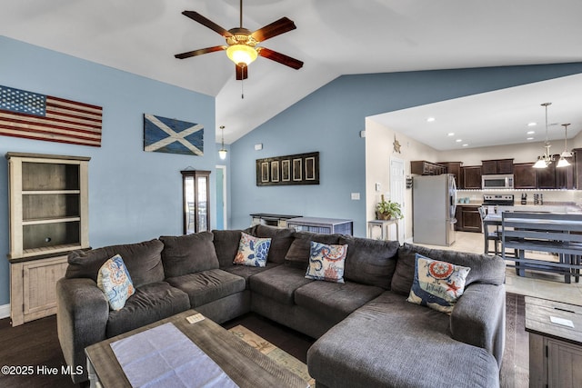 living room with a ceiling fan, recessed lighting, wood finished floors, and lofted ceiling
