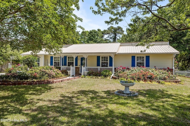 107 Palmetta Dr, Newport, NC 28570 - single story home with a porch, fence, metal roof, and a front yard