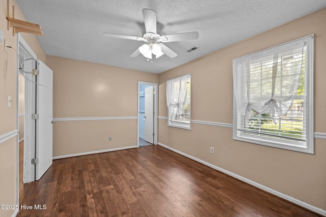 107 Palmetta Dr, Newport, NC 28570 - unfurnished bedroom featuring visible vents, wood finished floors, baseboards, ceiling fan, and a textured ceiling