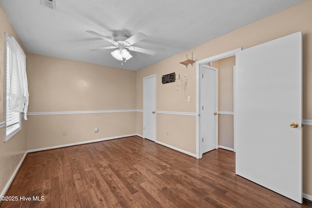 107 Palmetta Dr, Newport, NC 28570 - empty room with a textured ceiling, baseboards, a ceiling fan, and wood finished floors
