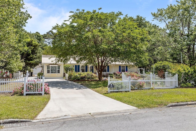 107 Palmetta Dr, Newport, NC 28570 - obstructed view of property featuring a fenced front yard, concrete driveway, and a front lawn
