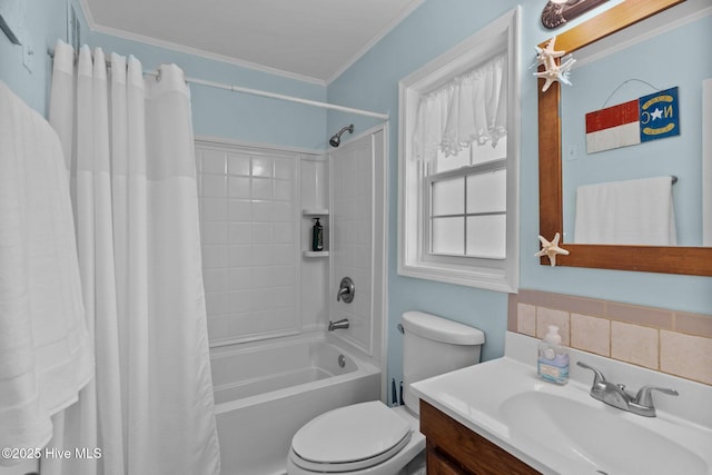 bathroom with crown molding, vanity, shower / bath combo, and toilet