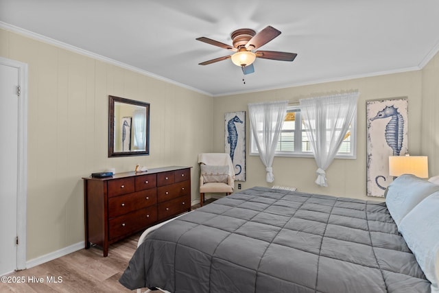 bedroom with a ceiling fan, ornamental molding, and wood finished floors