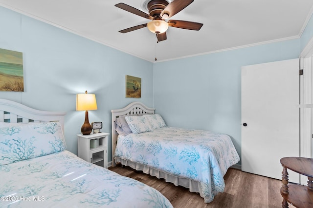 bedroom featuring ornamental molding, ceiling fan, and wood finished floors