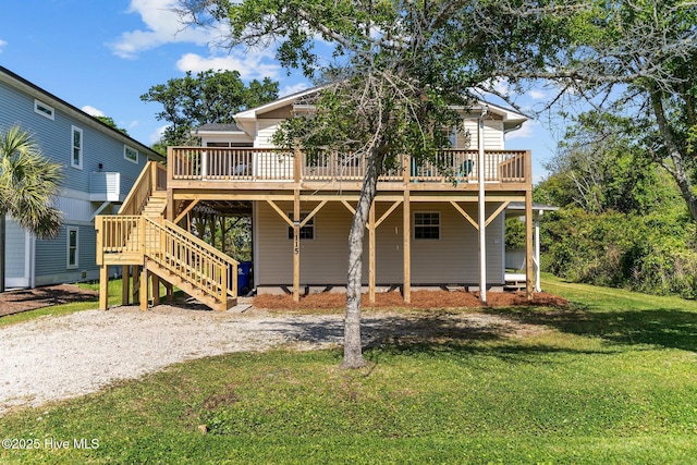 back of property featuring a yard, stairway, and a wooden deck