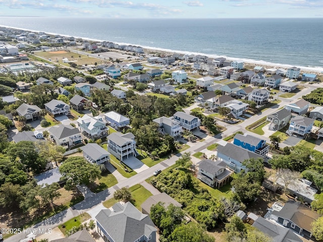 bird's eye view with a residential view, a beach view, and a water view