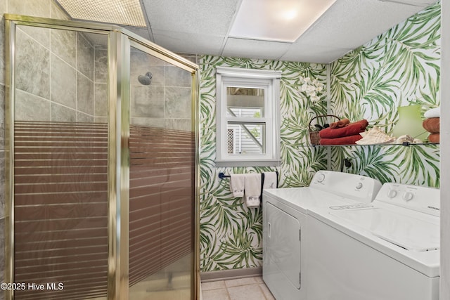 116 SE 8th St, Oak Island, NC 28465 - laundry room featuring laundry area, separate washer and dryer, wallpapered walls, and light tile patterned flooring