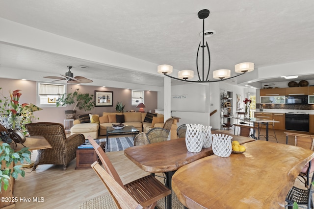 116 SE 8th St, Oak Island, NC 28465 - dining space with light wood-style flooring and ceiling fan