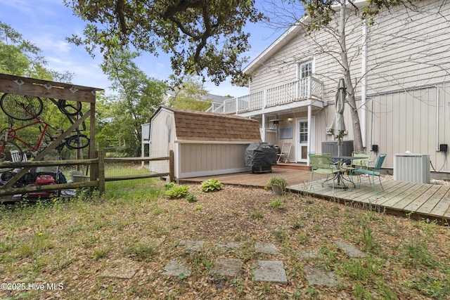 116 SE 8th St, Oak Island, NC 28465 - view of yard featuring cooling unit, an outdoor structure, a storage shed, and a wooden deck