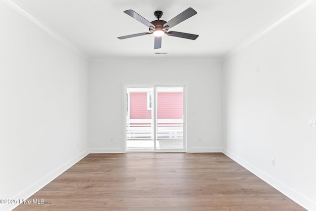 322 NE 50th St, Oak Island, NC 28465 - empty room with ceiling fan, baseboards, light wood-type flooring, visible vents, and ornamental molding