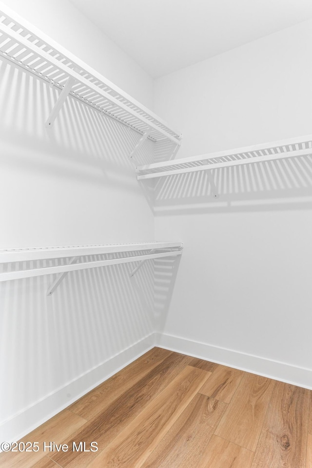 322 NE 50th St, Oak Island, NC 28465 - spacious closet with light wood finished floors