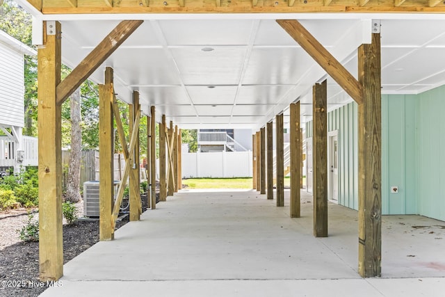 322 NE 50th St, Oak Island, NC 28465 - view of patio / terrace featuring central AC, fence, and an attached carport