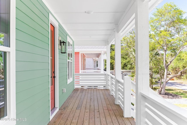 322 NE 50th St, Oak Island, NC 28465 - deck featuring a porch