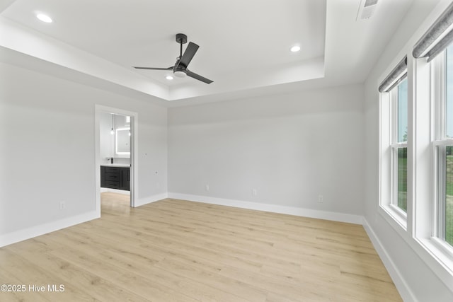 149 Pelican Pointe Dr, Elizabeth City, NC 27909 - interior space with light wood-style floors, recessed lighting, a tray ceiling, and a wealth of natural light