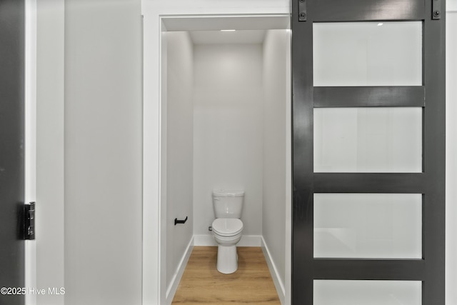 149 Pelican Pointe Dr, Elizabeth City, NC 27909 - bathroom featuring baseboards, toilet, and wood finished floors