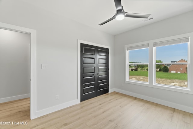 149 Pelican Pointe Dr, Elizabeth City, NC 27909 - unfurnished bedroom featuring baseboards, visible vents, light wood finished floors, and a closet