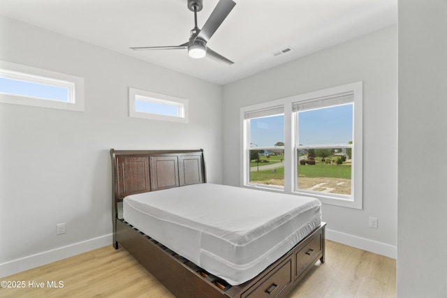 149 Pelican Pointe Dr, Elizabeth City, NC 27909 - bedroom with baseboards, multiple windows, light wood finished floors, and visible vents