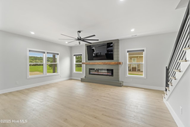 149 Pelican Pointe Dr, Elizabeth City, NC 27909 - unfurnished living room featuring stairway, ceiling fan, a fireplace, and recessed lighting