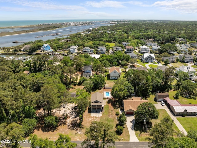 bird's eye view featuring a water view and a residential view