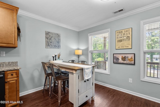 office featuring crown molding, baseboards, dark wood-style flooring, and a healthy amount of sunlight