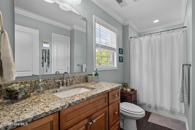 bathroom with visible vents, wood finished floors, vanity, toilet, and ornamental molding