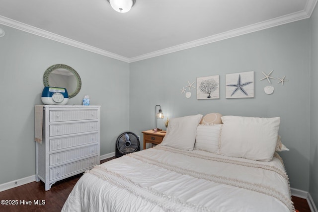 bedroom featuring crown molding, baseboards, and dark wood finished floors