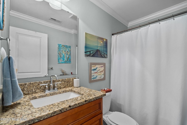 bathroom with crown molding, vanity, toilet, and visible vents