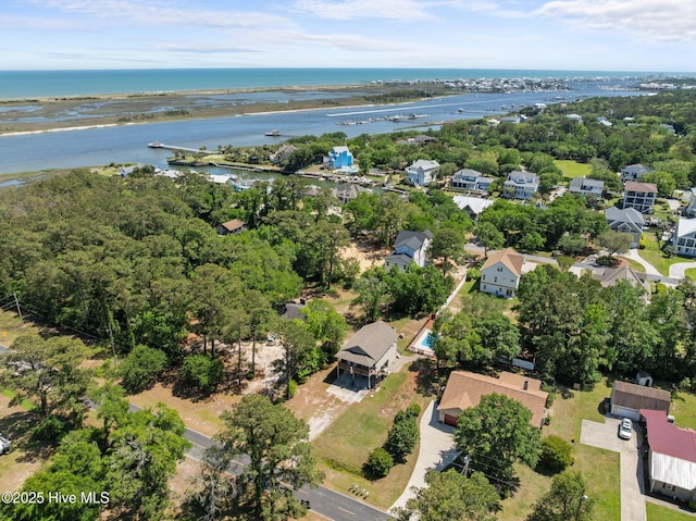 bird's eye view featuring a water view and a residential view