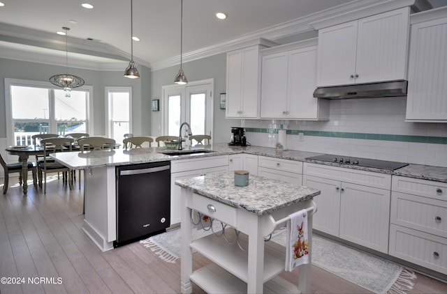 kitchen with open shelves, a sink, a peninsula, under cabinet range hood, and black appliances