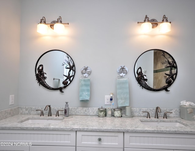 full bath with a sink and double vanity
