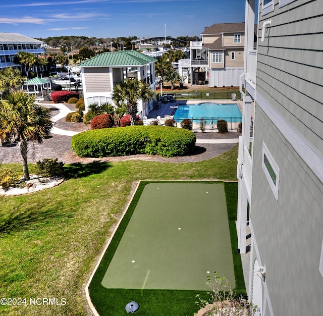 exterior space featuring a lawn and fence