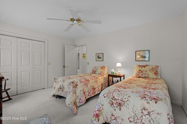 carpeted bedroom with a closet, a ceiling fan, and baseboards