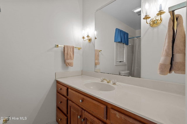 full bath with vanity and toilet