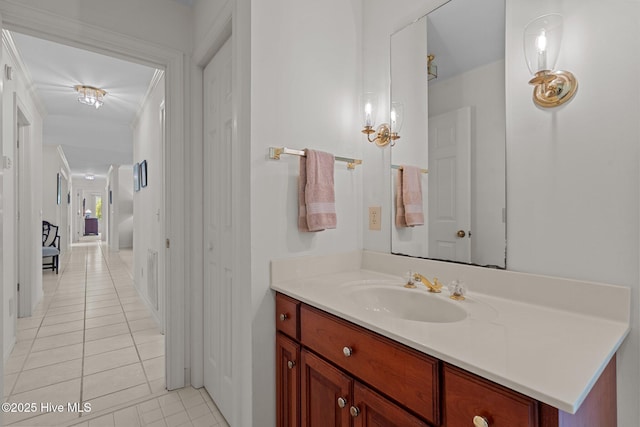 bathroom featuring tile patterned flooring and vanity
