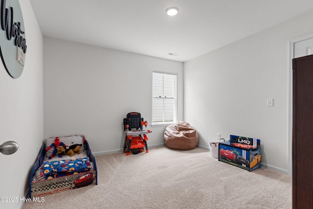 playroom with carpet floors and baseboards